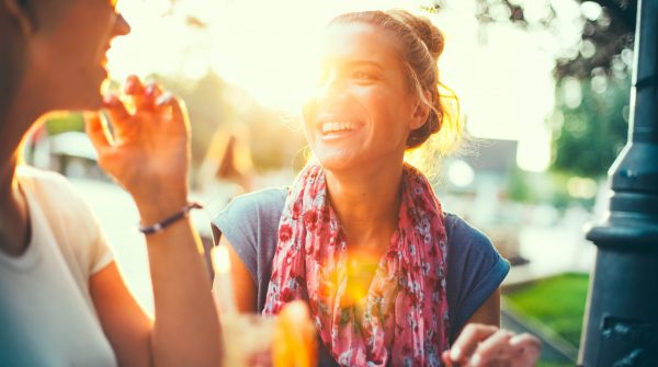 A photograph of two women out for coffee